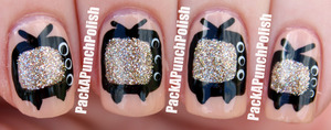Inspired by Zooey Deschanel's nails at the 2012 Emmy Awards! How cute were they? I had to recreate them!
The nude color is OPI Samoan Sand and the glitter is China Glaze I'm Not Lion.

http://packapunchpolish.blogspot.com/2012/09/zooey-deschanel-inspired-tv-nail-art.html