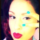 Statement lips and blue nails and liner.