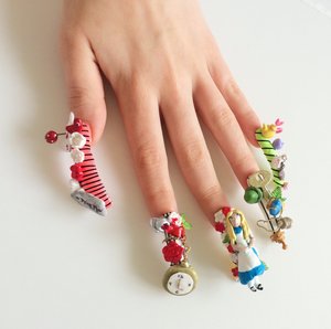 Ive always loved Alice In Wonderland nails on the web so thought I would create my own.

I crafted many of the items (Alice, tea pot, mushrooms etc) I also used acrylic for the first time which I used for the flowers and leaves. Which is your favourite nail? Think mine has to be the one with the clock!