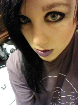 Gothic style eye shadow and purple lips

