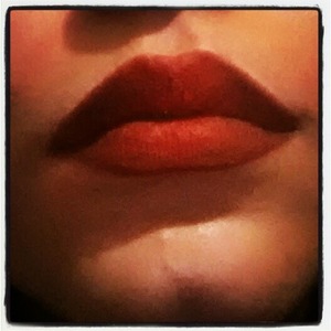 red lipstick with red eyeshadow on top