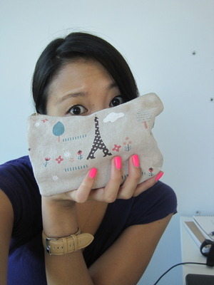 Showing off my bright pink nails + makeup bag :P