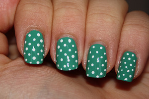 Base: Avon Peppermint Leaf - 2 coats
Polka dots made with acrylic paints.

http://iloveprettycolours.blogspot.com/2011/11/31-day-challenge-day-eleven-polka-dots.html