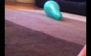 Throwing a dart at a balloon and popping it!