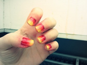Red, pink and yellow ombré nails
