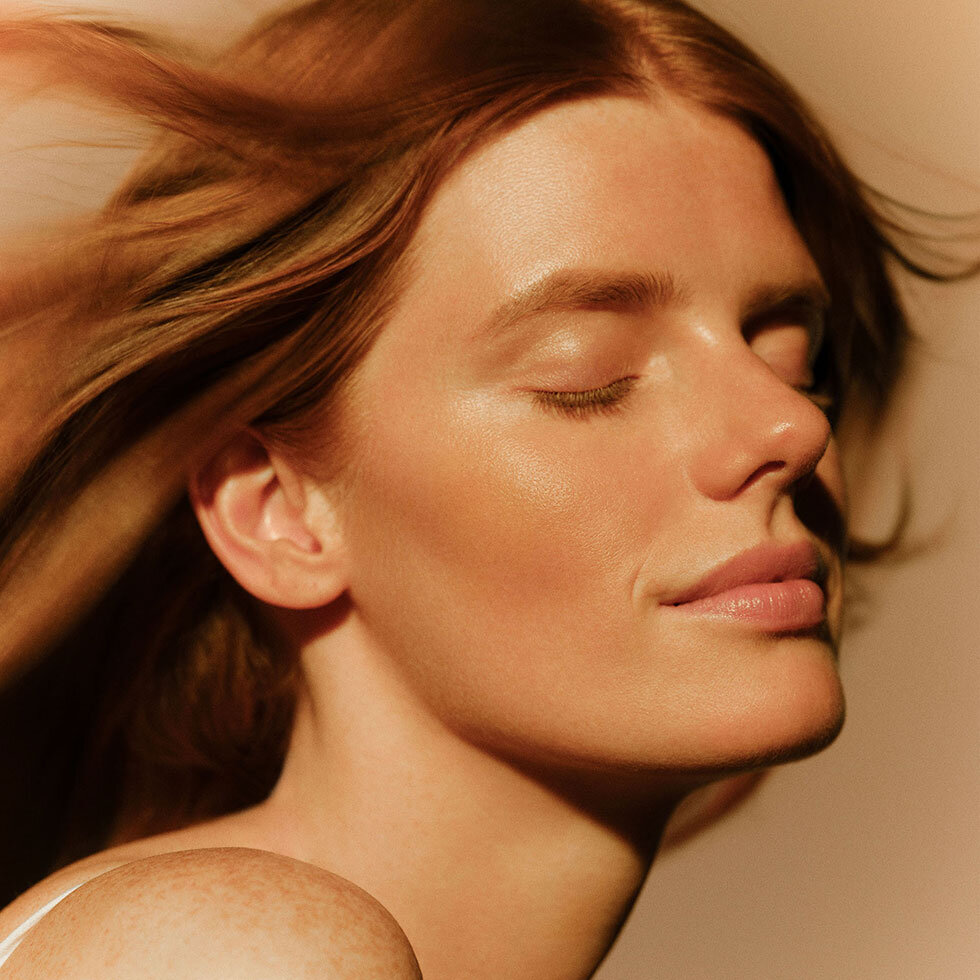 Model wearing Sisley Paris L'Orchidée Highlighter