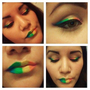 Rainbow colored and black winged eyeliner, with rainbow lips. 