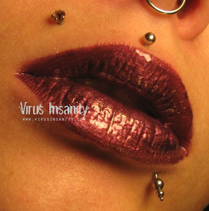 Virus Insanity Winter Berry lipgloss.
http://www.virusinsanity.com/#!lipglosses/vstc9=all-lipglosses/productsstackergalleryv29=9
