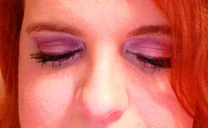 A shimmery mix of pinks and purples with a matte white highlight below the brow.   Pink on the lid and below the lower lash line.  Purple for the outer part of the lid and crease. Black sparkle eyeliner applied to upper lid and waterline.  (Colors used from Too Faced palette: Gum Drop on lid, Day under brow, Marshmallow around tear duct.  The purple is from FLiRT.)