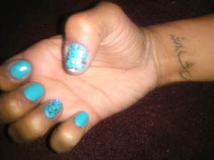 blue cotton candy nail polish with glitter sparkles. 