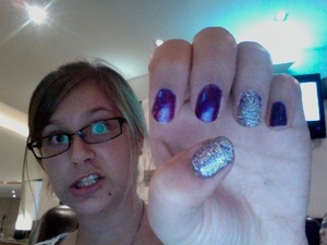 This is a nail design I did in a rush. I painted all of my nails two coats of a purple polish, then used a glitter polish on my accent nails, my thumb and ring finger. I had to paint multiple thick coats to get the glitter everywhere. I love this look!