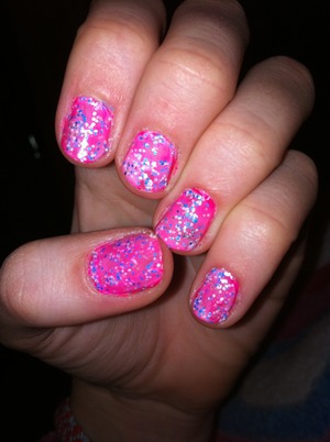 First do a base coat
Then a pink coat
An last put a multicolor sparkle coat on top.