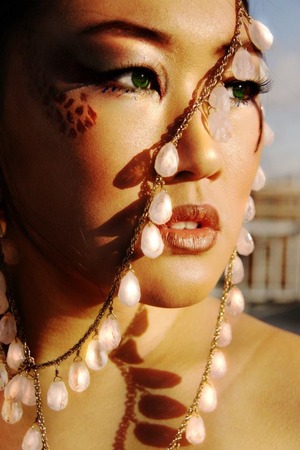 Taken on the roof of my apartment with a Forever 21 necklace. The eye color was after photoshop