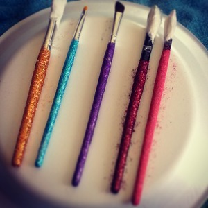 use mod podge for glitter (w/ orange ladle ) get a sponge brush apply then apply glitter . let dry to 5-15 min then apply mod podge again so when your doing your make up the glitter does not get all over the place. have fun doing it lady's I know I sure did (: 
