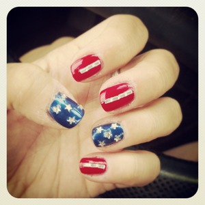 red and blue nails with stars and stripes gems.