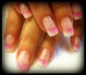 French tip with pink glitter gel fade out, and silver smile with art pen