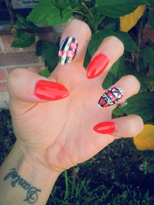red, tribal striped red flowers polished and uv coat on top of acrylic stiletto nails