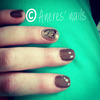 Brown Gel Nails With A Printed Nail Art