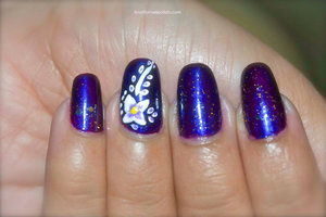 For more details visit http://lovefornailpolish.com/purple-and-white-flower-nail-art-pretty-floral-design