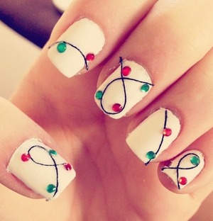 Paint nails white, then add a black thread and string it around your nails, then add crystals. :)