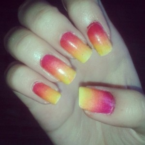 Sponge Ombre Nail Art on real nails using yellow, orange, red and burgundy.