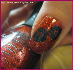 Nubar Fire Sparkle - a gorgeous red glitter polish.
I've reviewed it on my blog - here: 
http://rainbowifyme.blogspot.com/2011/12/nubar-fire-sparkle.html