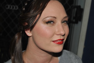 A Classic Corporate Look
emphasising defined red lips.
A side Pony tail with side braid.