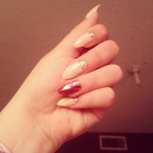 nude nail with glitter and red merallic accent nail:)