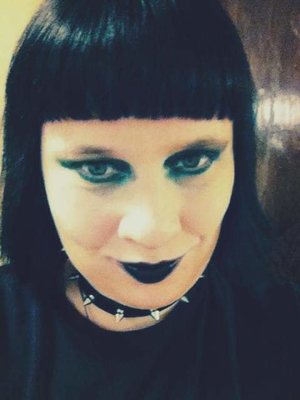 Green and black makeup with a Gothic Edge. 