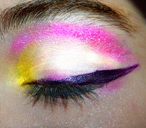 Combination of Gold,White and Pink, and black eyeliner ran over with purple cream eyeshadow