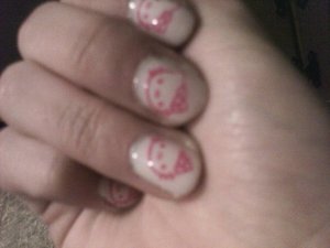 Four coats of China Glaze Moonlight stamped with Born Pretty Image Plate Hello Kittys stamped with Sinful Colors I Love You(?)