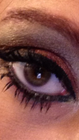 Color tattoo in cream for base maroon for inner and bottom of lid and gel black liner applied with brush in crease! 