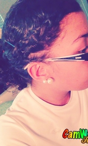 A cute, simple braid. Girls with really curly hair can pull it off too!
