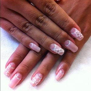 for polish.  Light pink, color of your choice.  Deep french style.  outline the smile line with small rainbow silver holograms and add the flower.  These flowers are raised sticker flowers from Japan.  I do know if you search eBay they have a variety of different nail art sticker flowers to choose from.
http://fingertipfancy.com/simple-flower-elegance