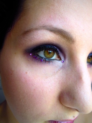 Some purple smokey eye with purple rhinestones and a black eye liner