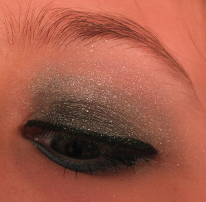 Just a simple smoky eye that's a little bit more night-appropriate because of the glitter and pop of blue on the lower lashline :)
