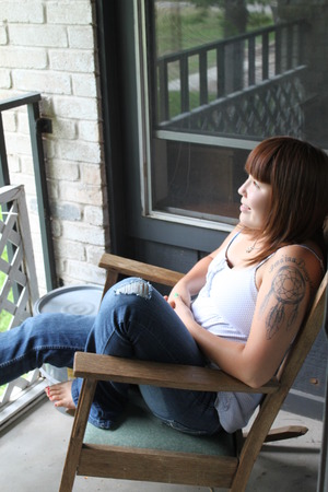I love sitting outside when I read. Plus, I wanted to show off my tattoo! :)