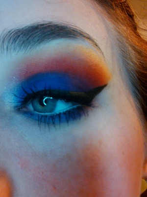 purple and dark blue mixed on lid, red orange to yellow faded  