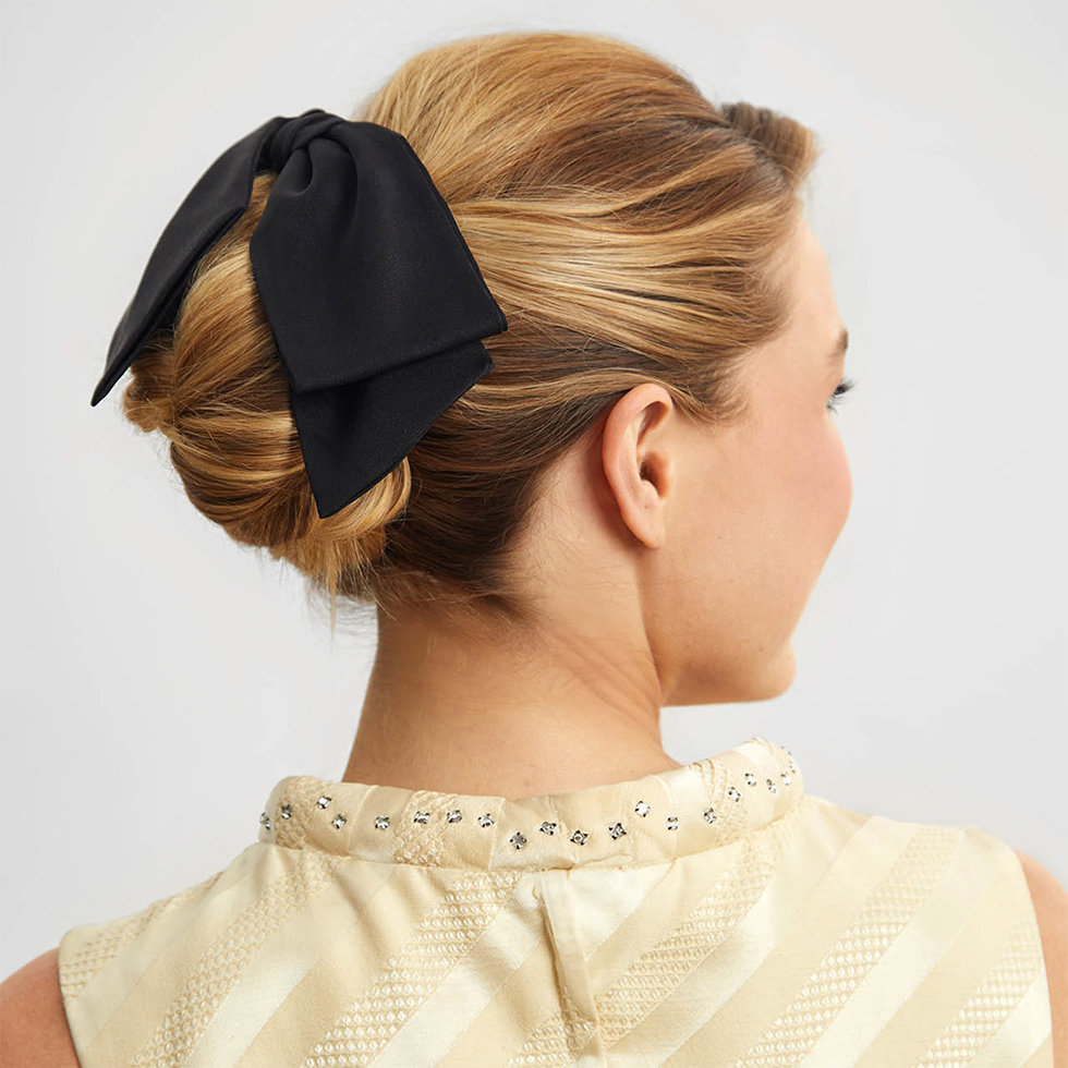 Kitsch model wearing the Recycled Fabric Black Bow Hair Clip