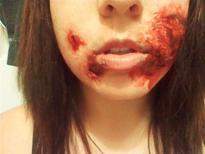 liquid latex. gel blood. black paint makeup. patience. love it. ask for tips.