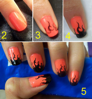 Halloween Flame Nails How-to:
1) White or neutral-colored nail polish
2) Orange nail polish
3) Draw flame outlines with a nail pen or Sharpie
4) Fill in flame with black polish
5) Finish with topcoat