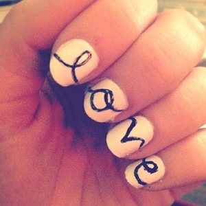 White nails with black lettering
