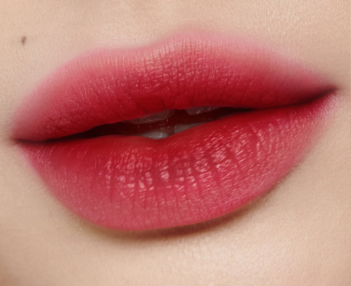 Charlotte Tilbury lip model wearing Ruby Blur blurred