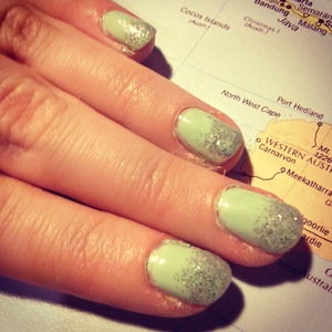 Mint nail polish with silver glitter tips
