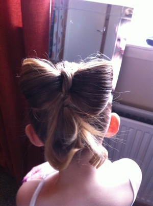 Hair tied in a bow in my little girls hair :)
