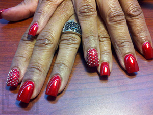 China Glaze Red Pearl with spike accents.