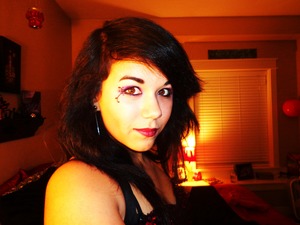 Me trying out a felt tip eye liner by Almay. Lipstick a creation of my own. 