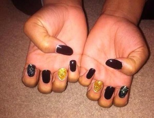 I used my gel nail kit do this. I sculpted her nails with gel polish and added some craft glitter. Trying to get into the nail thing.