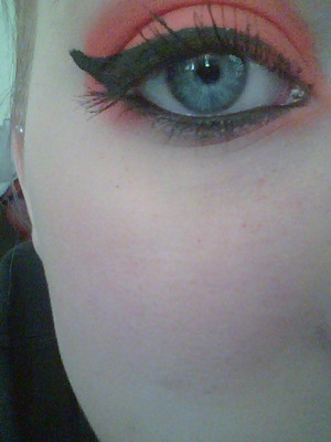 winged eye with red eye shadow