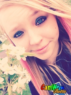 My beautiful cousin. Outside on such a gorgeous sunny day, with those flowers portraying her pretty face. :)